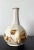 A Korean ceramic bottle with octagonal faceted form with underglaze copper red decoration. The robust bottle with the long...