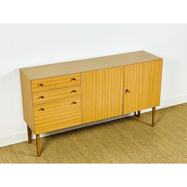 Vintage Formica sideboard, featuring two storage doors, two drawers, and a hinged door. Dimensions: H76 W134 D35
