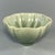This vintage‑style flower‑petal shaped celadon bowl is covered with delicate natural crackle‑texture green glaze....