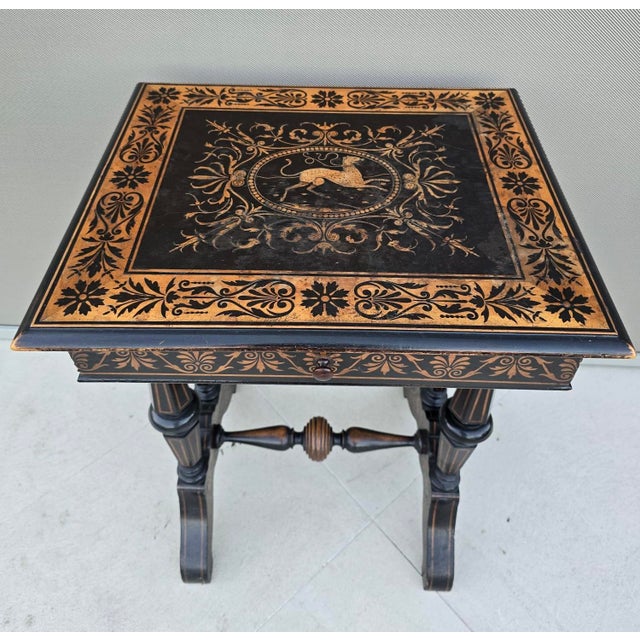 Elegant Italian Neo-Renaissance work table from the late 19th century, executed in ebonized wood with finely detailed...