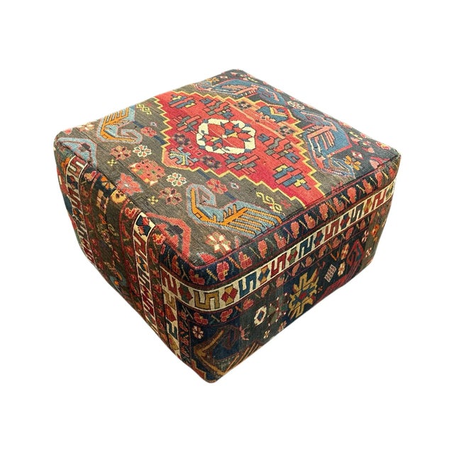 Antique Turkish rug that had been upholstered into a custom ottoman many yeas ago. The rug is full of many colors...