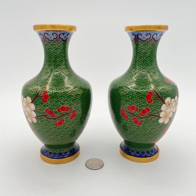 Lovely set of petite cloisonné bud vases with a mirrored cherry blossom pattern on a rich green field. Coin in photos...