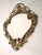 A magnificent Rococo-style Louis XV bronze mirror from mid-20th-century France. This mirror is crafted from solid bronze...