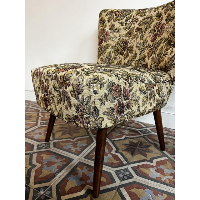 Mid-century cocktail armchair with floral fabric Provides good back support and is very comfortable and sturdy....