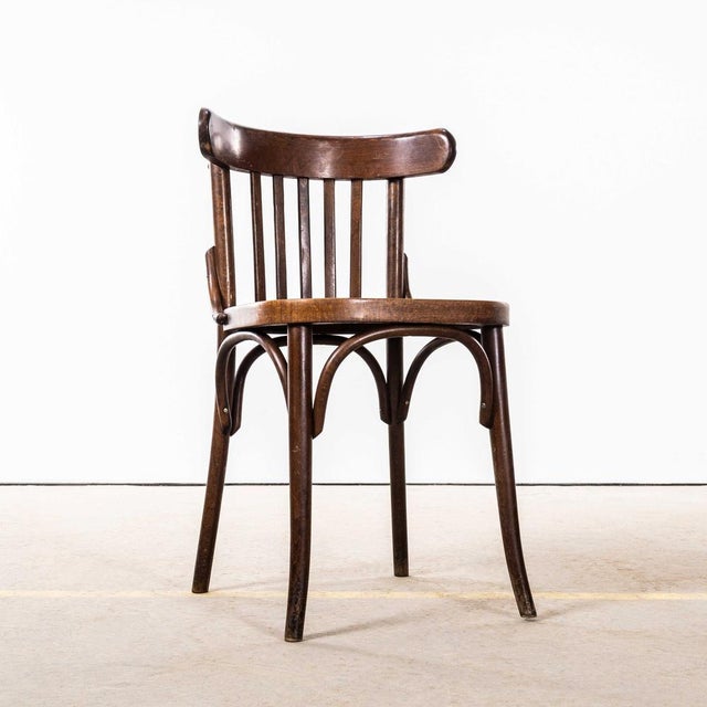 1950’s Dark Oak Bistro Bentwood Dining Chairs. Good quality classic bentwood chairs with a deep dark oak colour and...