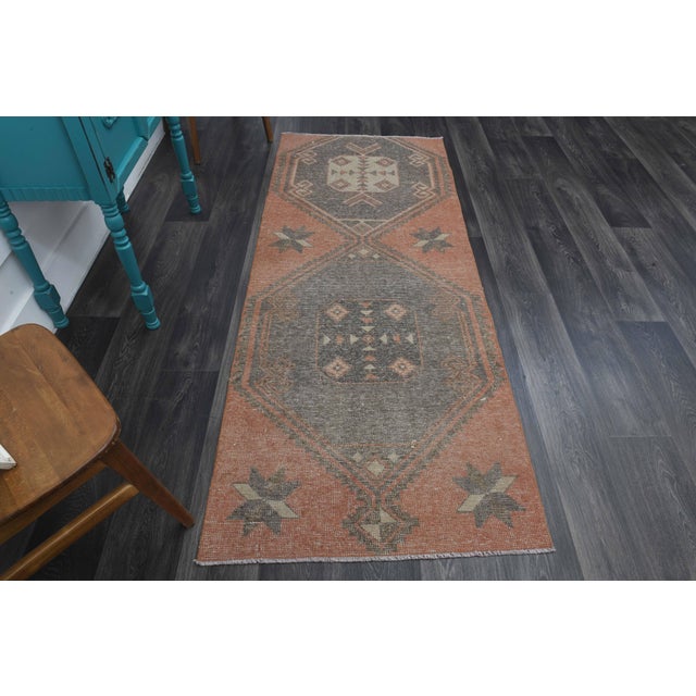 Vintage Hand-Knotted runner rug is a semi-antique vintage runner rug. The '70s Eastern region of Anatolia's unique rug is...