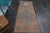 Vintage Hand-Knotted runner rug is a semi-antique vintage runner rug. The '70s Eastern region of Anatolia's unique rug is...
