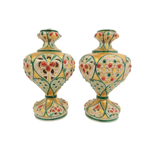 Pair of antique Italian Majolica polychrome and gilt baluster urns. Embossed with stunning bright colors with a textured...