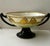 An elegant turn-of-the-century porcelain centerpiece bowl, hand painted and signed C. M. Button. Dating to approximately...