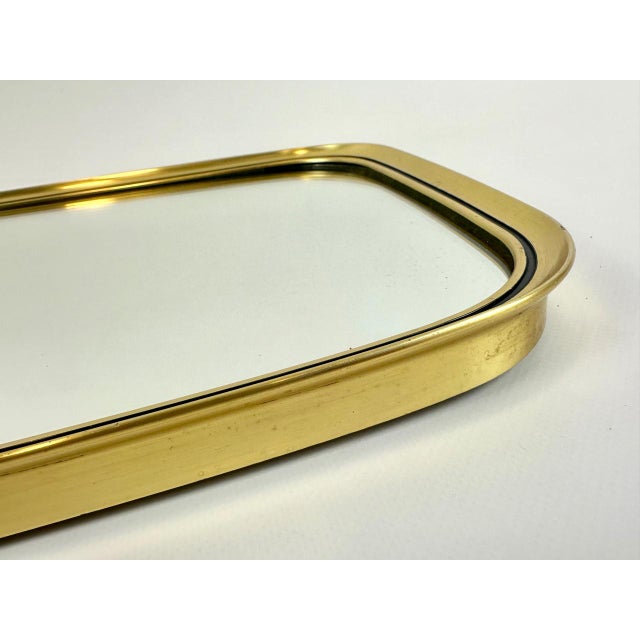 Mid-Century Modern German Wall Mirror in Aluminium and Brass, 1960s, in Very Good conditions. Designed 1960 to 1969