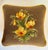 This charming vintage needlepoint pillow features a hand-stitched floral bouquet in warm yellows with sienna accents, and...