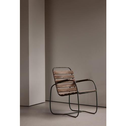 A charming Swedish garden armchair from the 1930s, featuring a sculptural tubular steel frame with aged green patina and...