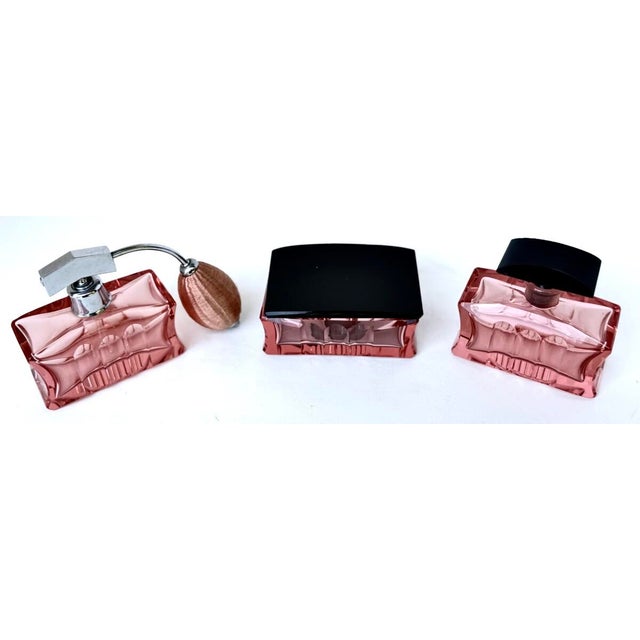 Fine quality Art Deco (3) piece pink crystal dresser perfume vessel set; matching the "Rose Tiente" Bambous pattern made...