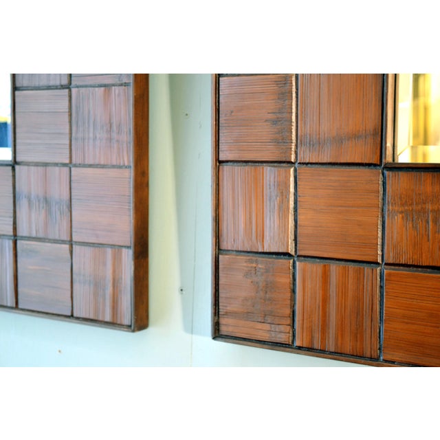 Pair of square mirrors with a decorative border consisting of square blocks of textural brutalist horizontal and vertical...