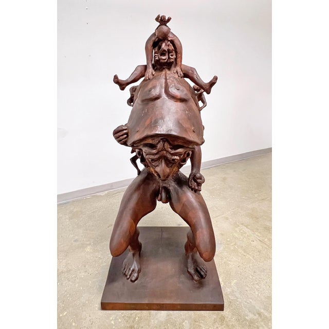 A figurative and imaginative carved sculpture in stack laminated black walnut circa 1960s. According to the family, the...