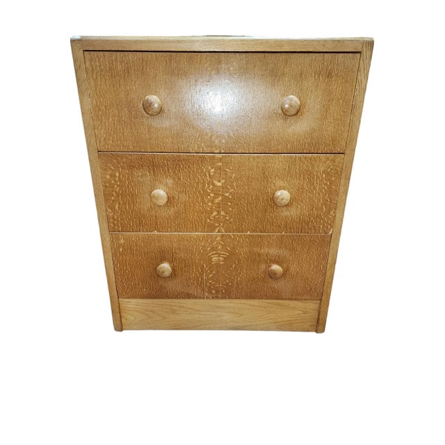 Lovely mid century modern three drawer chest with adjustable mirror by Herbert Gibbs of England in light oak. Beautiful...