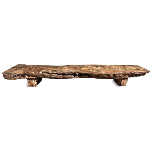 Vintage large lychee wood bench. Free from solid piece with a raw burned finish. Organic natural textures and flowing form...