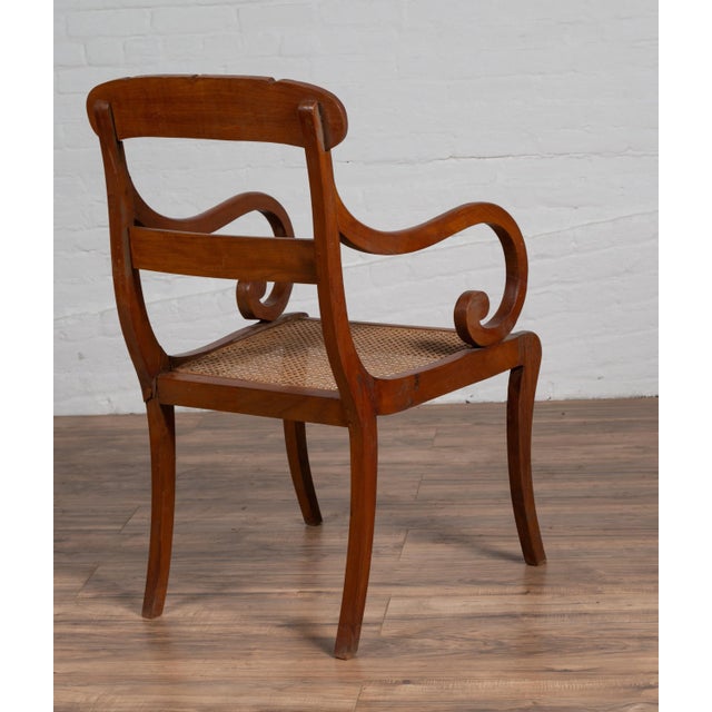 Antique Javanese Wooden Armchair with Carved Back, Curving Arms and Rattan Seat For Sale - Image 4 of 13