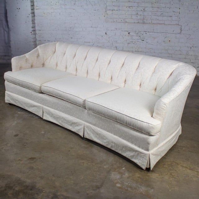 Wonderful vintage Hollywood Regency sofa by Waters wearing an off-white Brocade fabric with textured leaf details, button...