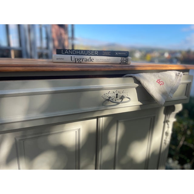 This charming antique sideboard has been repainted, sanded, and oiled. The interior has been completely sanded. Width:...