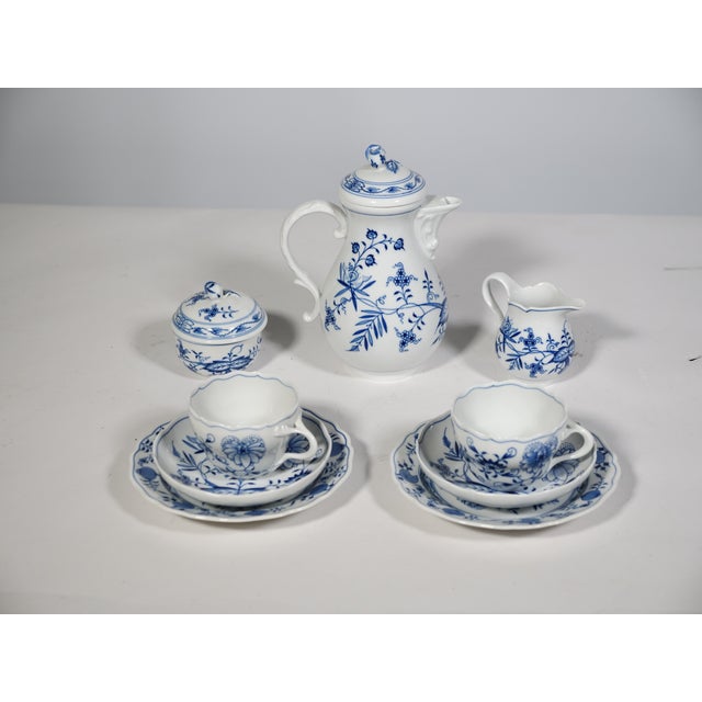 Classic Meissen coffee and tea service from the 1960s in the Blue Onion pattern. White porcelain with cobalt blue floral...