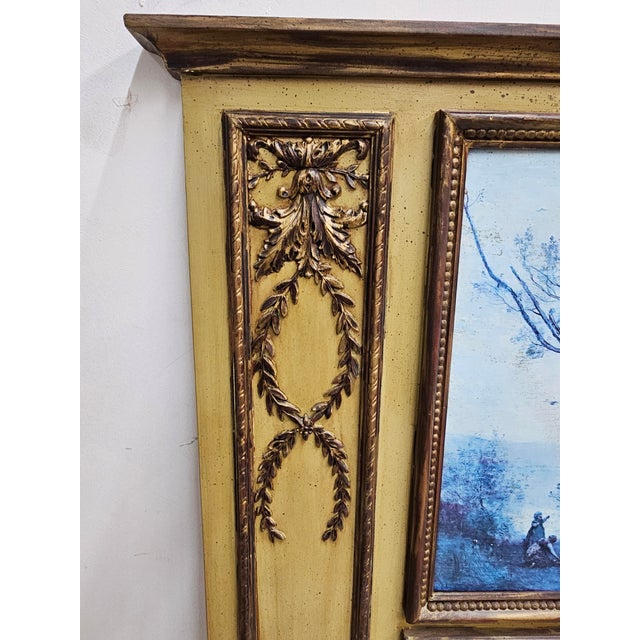 A Louis XVI Style Hand Painted and Parcel-Gilt Large Trumeau Mirror. Measures 44.5" in width and 59.5" in height and 2" in...