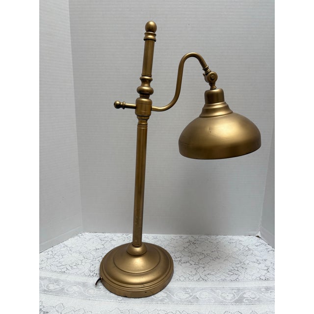 Vintage gold toned desk or table lamp with the cord cut. This will not work with electricity but will work with a...