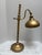Vintage gold toned desk or table lamp with the cord cut. This will not work with electricity but will work with a...