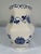 A beautiful hand painted blue and white Chinoiserie vase with stylized florals scrolling on all six sides. Circa Mid to...