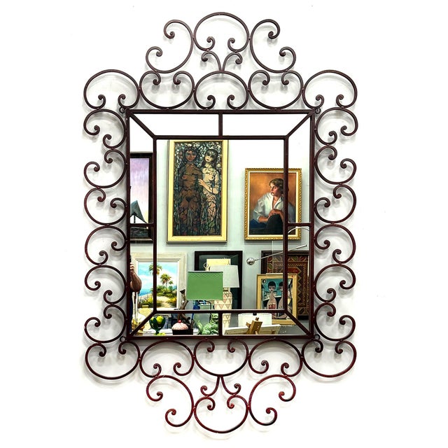 Monumental Ornate Vintage Scrolled Iron Wall Mirror Offered for sale is a monumental vintage Hollywood Regency–style wall...