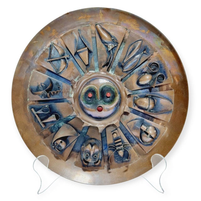 Copper wall relief from the 1970s. The depicted motifs and the stylized nature of the face indicate a unique artistic...