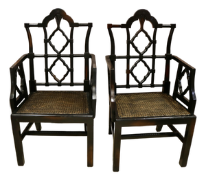 Vintage Chinoiserie Black Carved Wood Arm Chairs With Caned Seat - A Pair