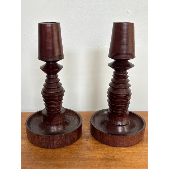 Mid-century turned wood candlestick holder pair with a rustic Folk Art feel. Most items found at Pub & Oasis are vintage...