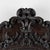 Early 20th century carved oval mirror from Portugal, crafted in oak. Highly decorative carving accentuates the frame, with...