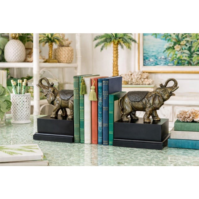 A charming pair of vintage elephant bookends featuring beautifully cast metal elephants with a rich bronzed finish, each...