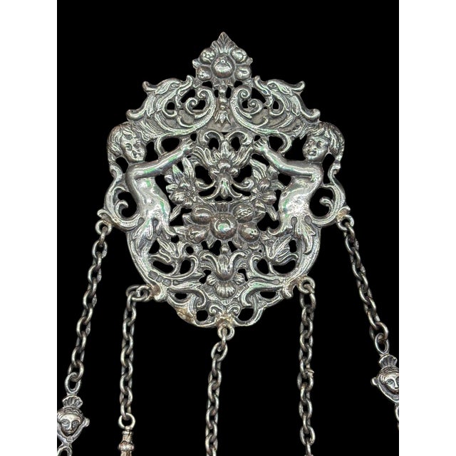 This English sterling silver Victorian sewing chatelaine is a stunning example of 19th & early 20th century craftsmanship,...