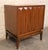 Pair of mid-century modern walnut grain bedside cabinets. Designed with a wonderful sculpted diamond front pattern and...