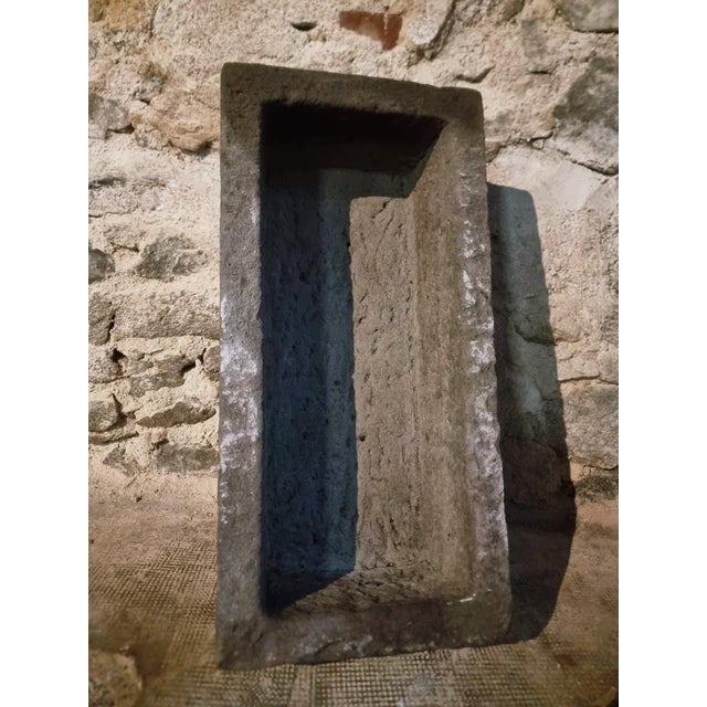 This antique stone trough is carved from solid Volvic volcanic stone, originating from the Puy-de-Dôme region in central...