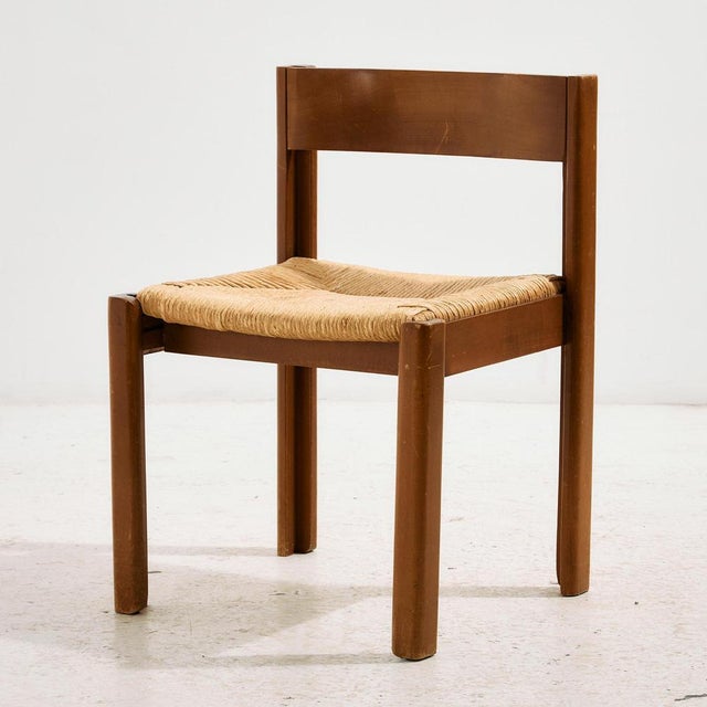 Beech dining chair from the 1970s with curved backrest and natural papercord seat.The surface of the chair has scratches,...