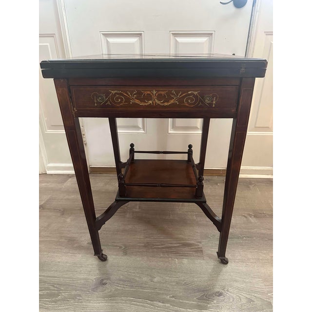 Add a touch of historical elegance to your home with this Early 20th Century Louis XVI Style Inlaid Handkerchief Card-Game...