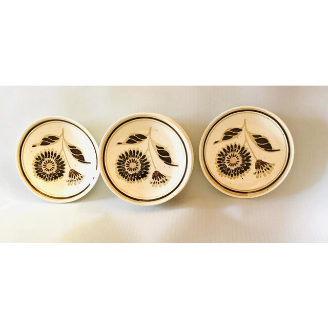 Midcentury set of 7 floral design dessert / Bread plates 6.40” D, makers mark reads “ USA”