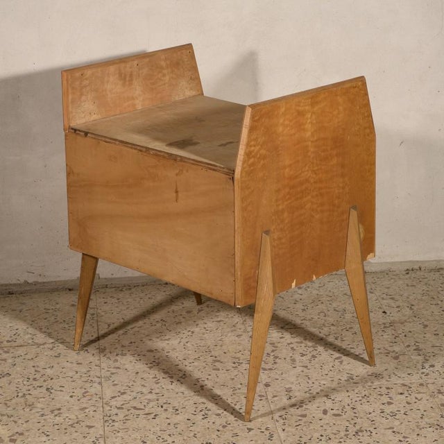 Cabinet nightstand with two drawers, typical of the 70s with high foot and stylized lines. The bedside table has scratches...