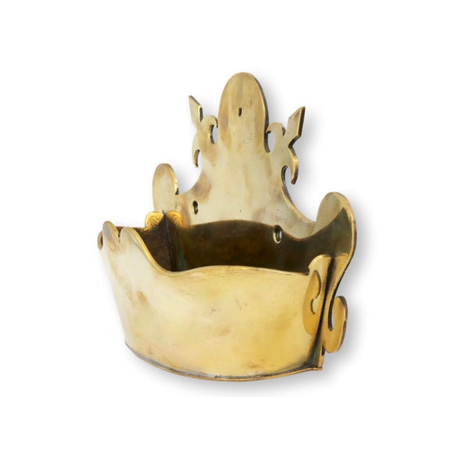 Victorian brass crown-form wall pocket, hand made with pierced detailing and a warm, time-worn patina. The sculptural form...