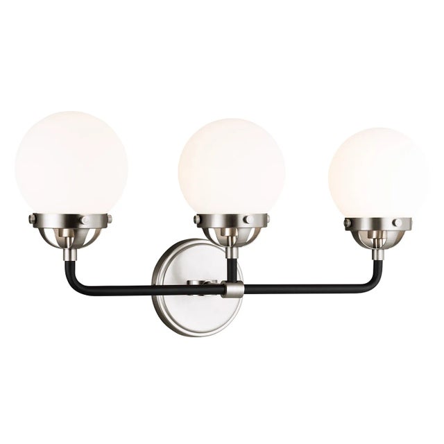 The Cafe three light vanity fixture in brushed nickel provides abundant light for your bath vanity, while adding a layer...