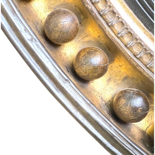 A Charming Regency Period Circular Giltwood And Gesso Convex Mirror Of Good Bold Proportions, Having Superbly Carved Eagle...