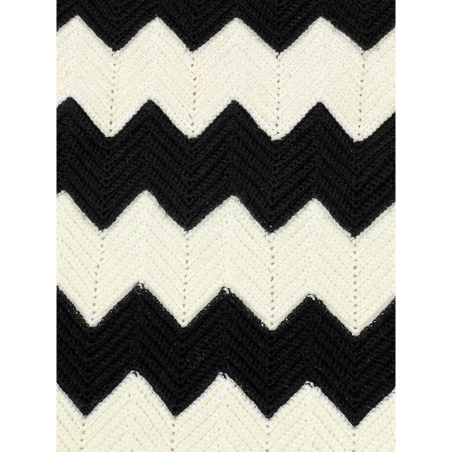 Add some bold minimalist mod vibes to any room with this stark black and white retro hand made blanket. This needlework...