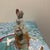 This vintage hand-painted porcelain bell depicts a Victorian or "Southern Belle" style lady. She is featured wearing a...