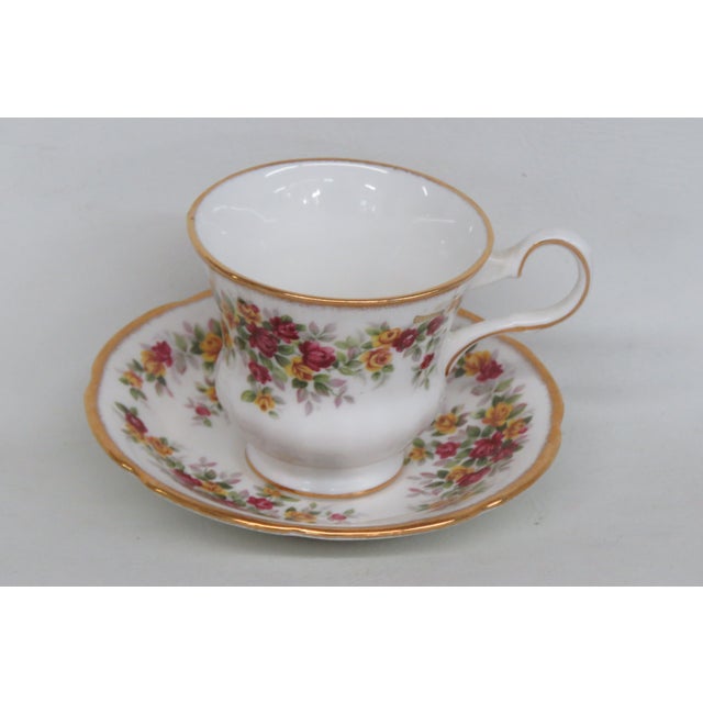 This lovely tea cup is made of bone china. This set is stamped as being made by Royal Grafton in England. It features a...