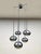 Shine bright! You will immediately make an impression with this beautiful chrome hanging lamp / chandelier from 1970....