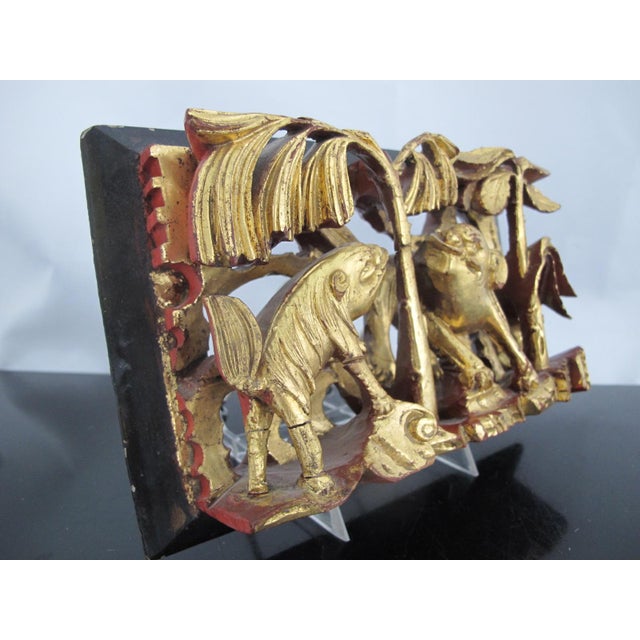 Chinese Qing Dynasty era elaborate carved wood panel showing 2 foo dogs or fantastical creatures in a grove of trees....